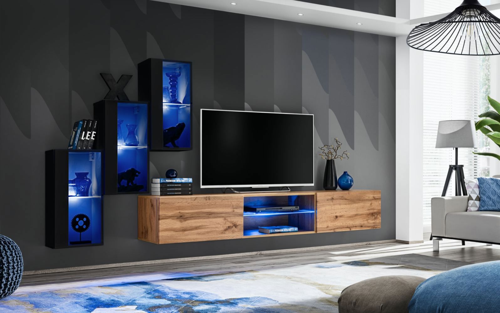 Wohnwand mit blauer LED-Beleuchtung Volleberg 30, Farbe: Schwarz / Eiche Wotan - Abmessungen: 120 x 210 x 40 cm (H x B x T), mit fünf Türen